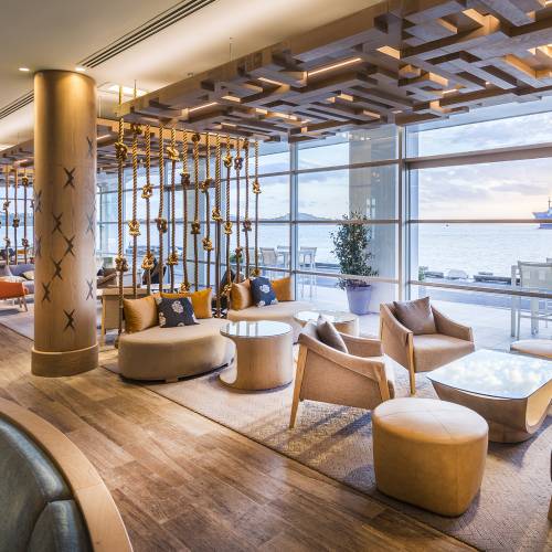 Bar seating area with the waterfront outside