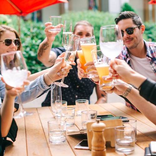 People cheering their drinks