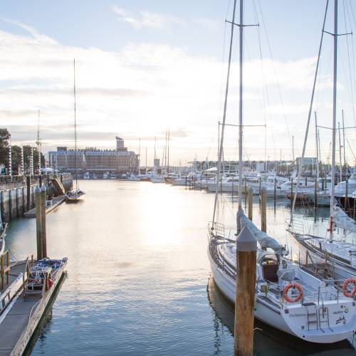 Waterfront with sails and sea