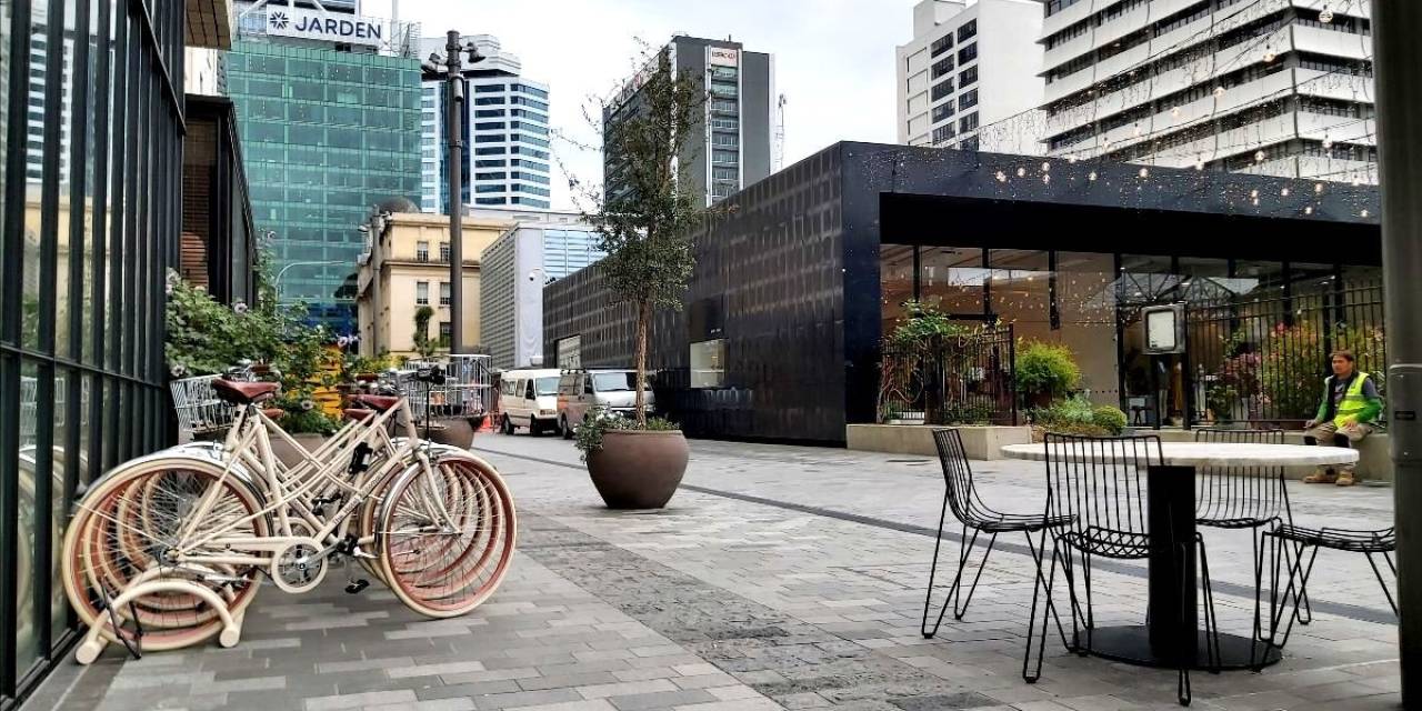 Galway Street in Britomart - an attractively paved shared space with bikes parked in front of a building and outdoor cafe seating.