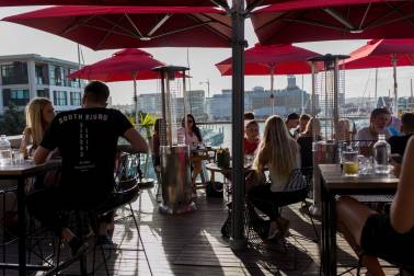People enjoying roof top deck