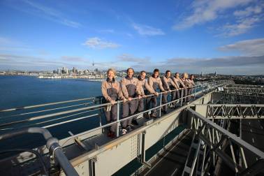 People standing on bridge