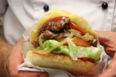 Chef holding burger