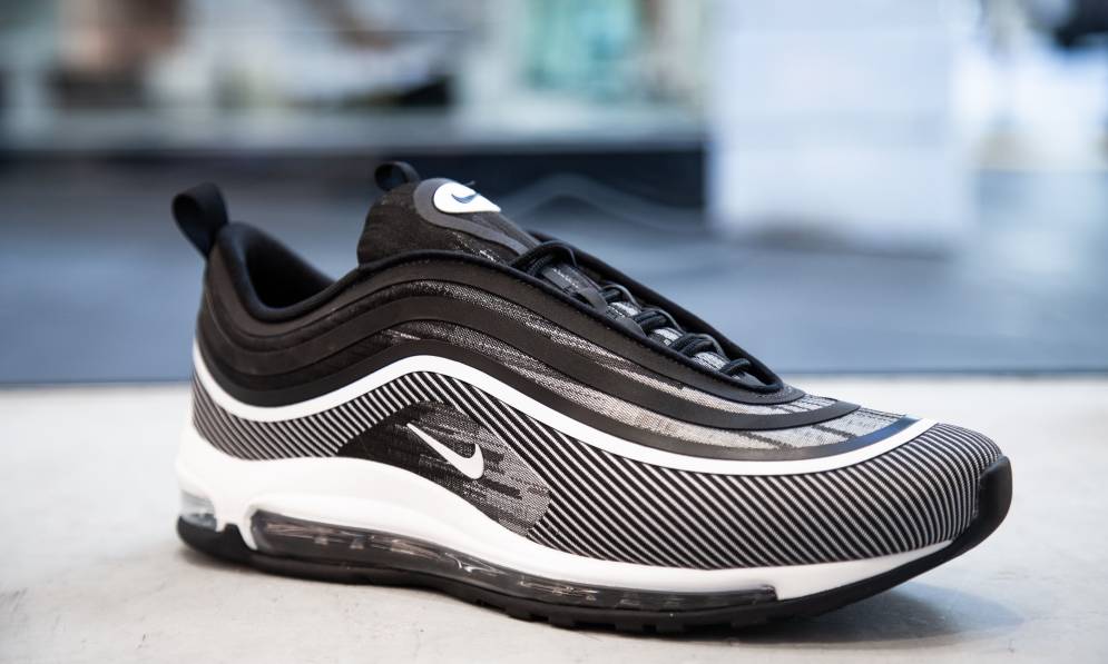 Black and white Nike 97 shoes