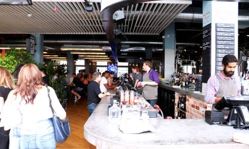 People enjoying bar area