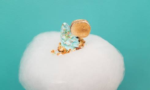 Cloud of candy floss with ice cream pushing through the top