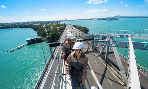 People standing on bridge 