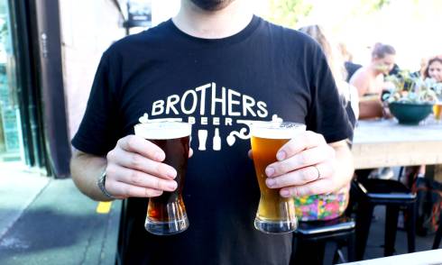 Staff holding two beers