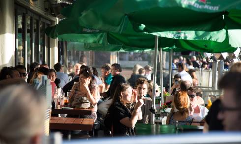 People sitting outside in the sun