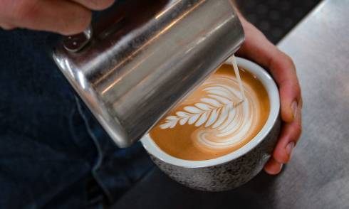 Pouring milk into coffee