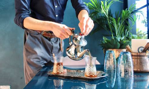 Waiter serving a drink