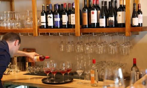 Bartender pouring wine