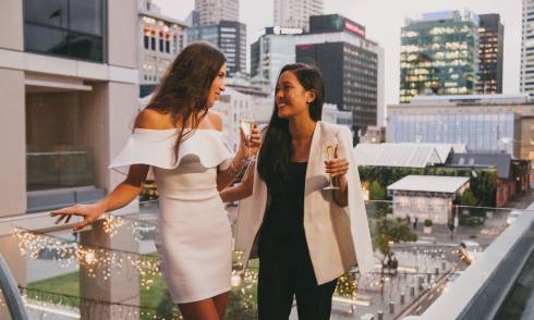 Ladies drinking on a balcony