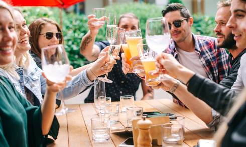 People cheering their drinks
