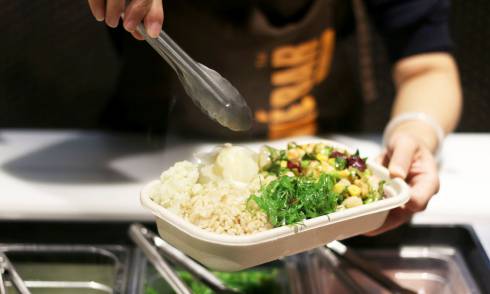 hand making the poke bar