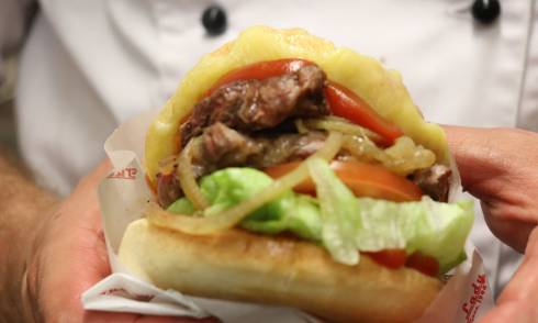 Chef holding burger