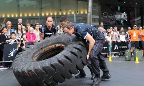 Man lifting truck tire