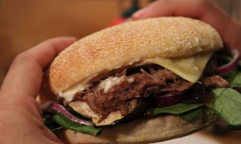 Person holding burger