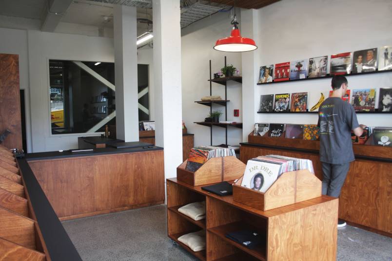 Records displayed on wood shelf
