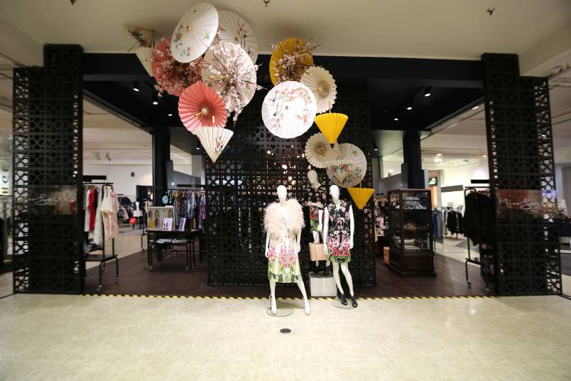 Mannequins displaying dresses along side Japanese Oil-paper umbrellas