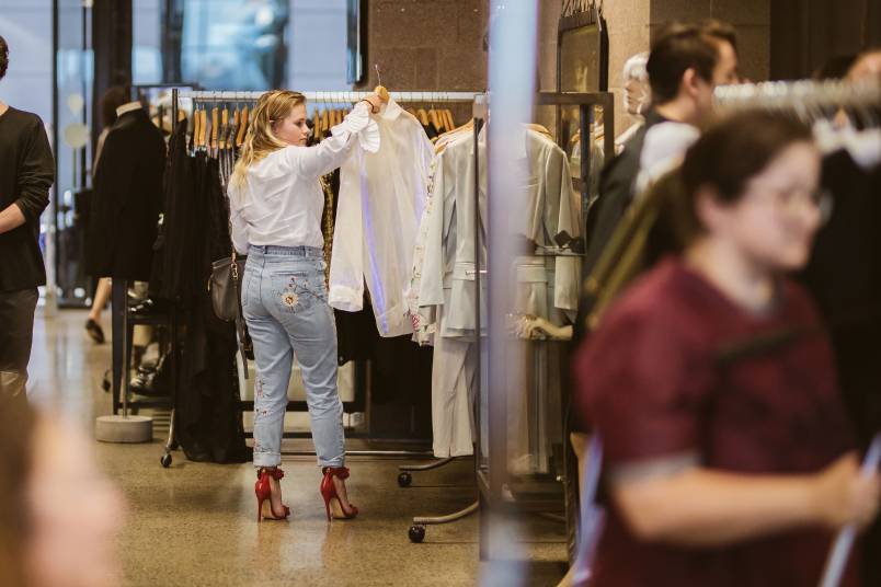 Customers browsing garments
